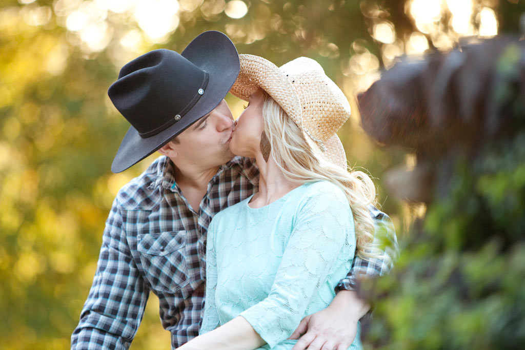 Engaged couple kissing