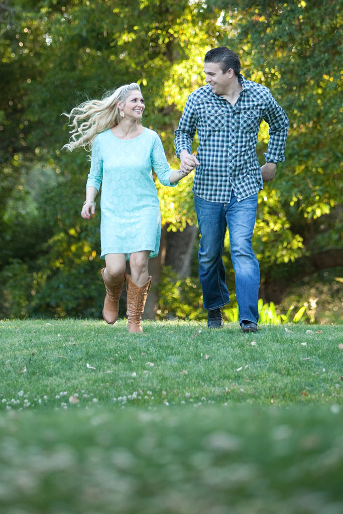 Engaged couple running