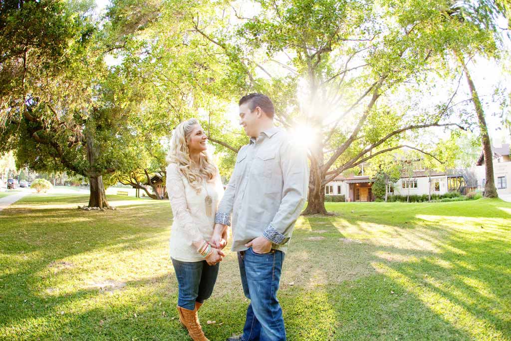 Engaged couple holding hands