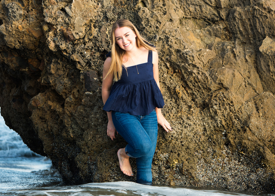 high school senior standing in the water