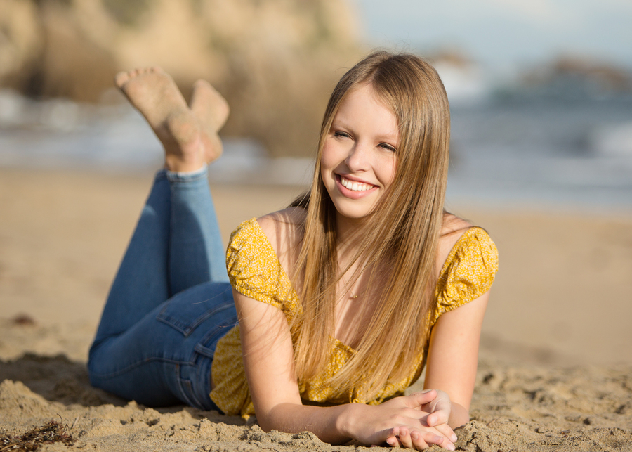 Girl lying down at the beach
