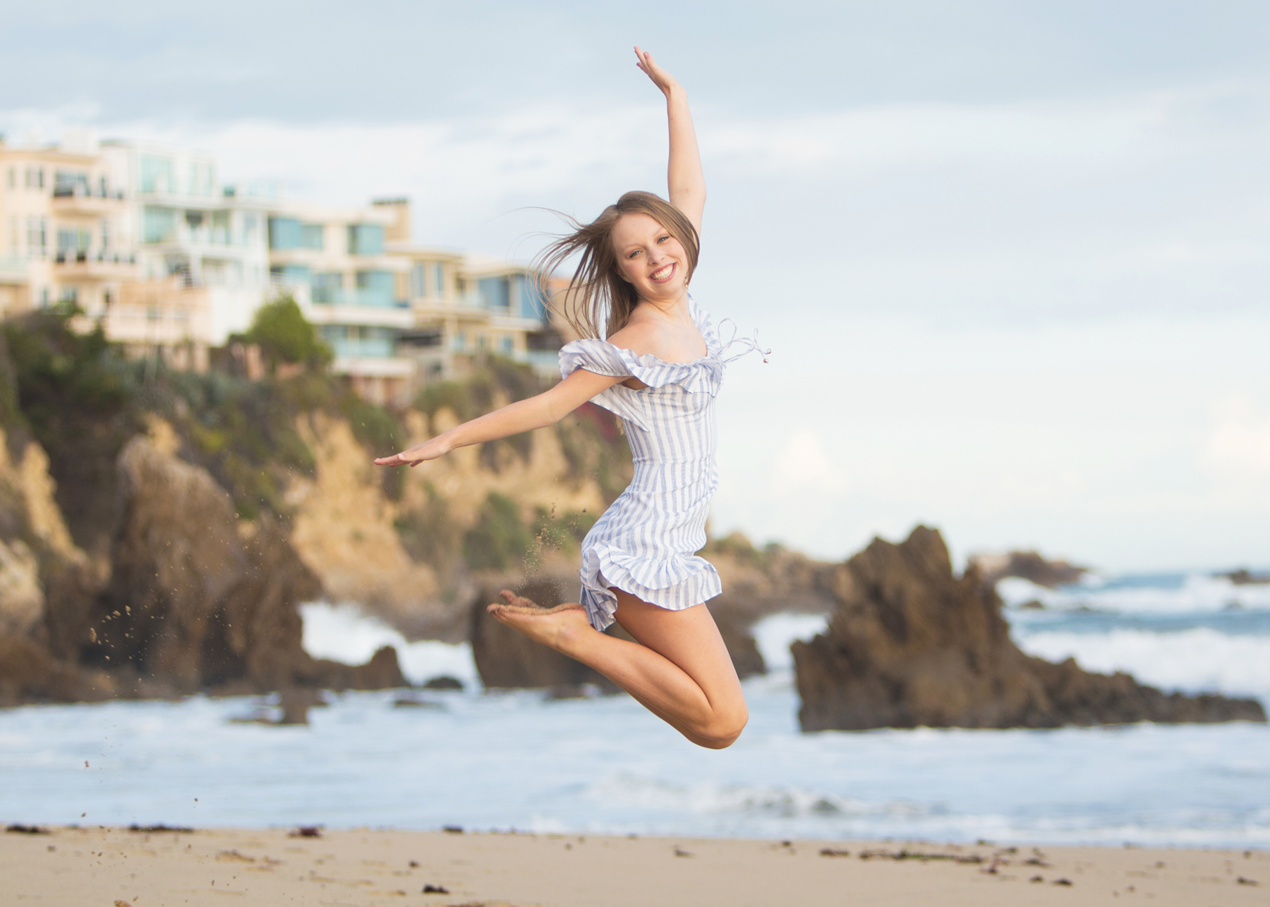 Girl jumping at the beach